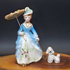 [R2552] Figurine porcelaine femmme avec son chien et son ombrelle